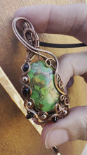 Load and play video in Gallery viewer, Reserved for Tanya r Green Mojave Turquoise with Hematie + Onyx gem inclusion Wire Wrapped Pendent Necklacet
